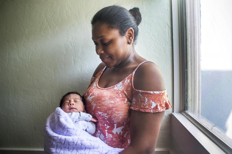 Sheylis Arroyo with her baby at Jelani House. Delays in the city’s bureaucracy have kept other women from moving into the house, even when there are open spots. (Photo: Pamela Gentile)