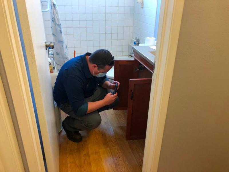 John Mezzapesa, a San Luis Obispo code enforcement officer, inspects a bathroom sink in a rental home in the city. San Luis Obispo has more code enforcement staff than any city in San Luis Obispo County.