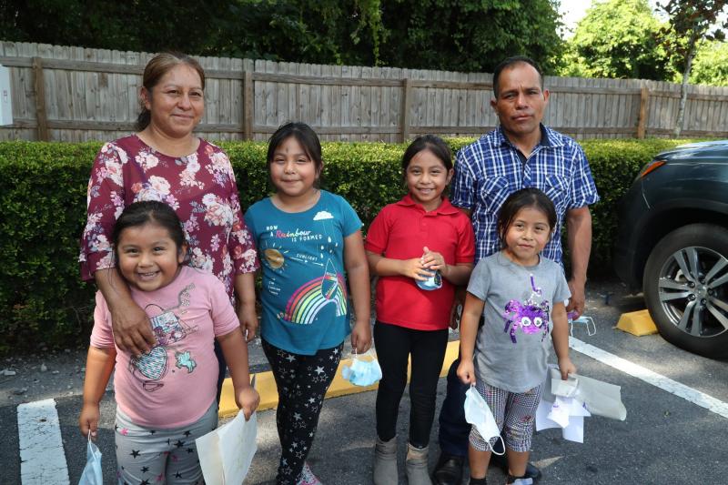 Jesus Hernandez and his wife, Julia, both farmworkers in the Plant City area, with their daughters Zaira, 4, Yaretzi, 7, Yareli, 7, and Yulisa, 5. Right, Yulisa and Zaira Hernandez in preschool at Redlands Christian Migrant Association center in Dover, Florida. The organization provides bilingual education. At the preschool, teachers use English and Spanish to bolster language skills. The girls now speak English too. ANDREA MELENDEZ/THE NEWS-PRESS/USA TODAY,FLORIDA NETWORK