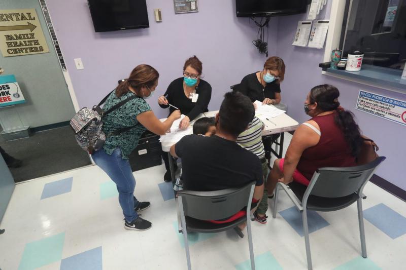 A vaccination clinic targeted at farmworkers on Wednesday, April 13, 2021, in LaBelle at Family Health Centers of Southwest Florida. Sylvia Delgado (center left)  and her team worked to get the 50 vaccines dispered. She checked people in. Andrea Melendez/The News-Press/USA Today, Florida Network