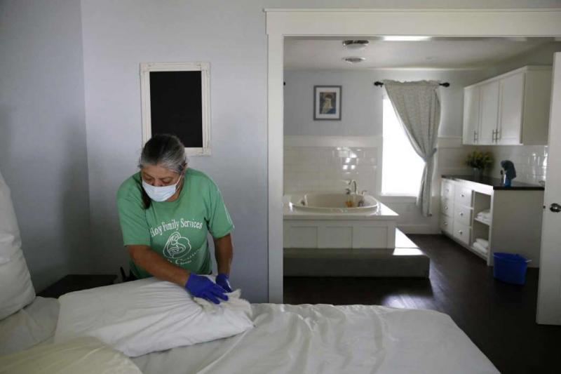 Maria Peña cleans one of three birth houses at the Holy Family Birth Center. The center has cared for mothers and babies in Weslaco for nearly 40 years. Jerry Lara /Staff Photographer