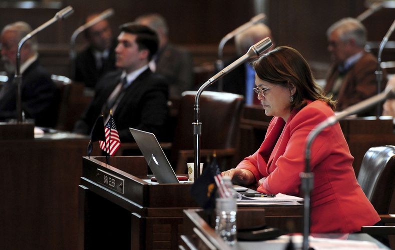 (Brent Drinkut | Statesman-Journal via AP) In this Feb. 2, 2015, photo, Sen. Sara Gelser, D-Corvallis, sits at her desk during the opening day of the Oregon legislative session at the Capitol in Salem, Ore.