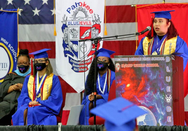 Jasmine Calderon, Pahokee High School's valedictorian, delivers her commencement speech during graduation at the South Florida Fairgrounds. TIM STEPIEN/THE PALM BEACH POST