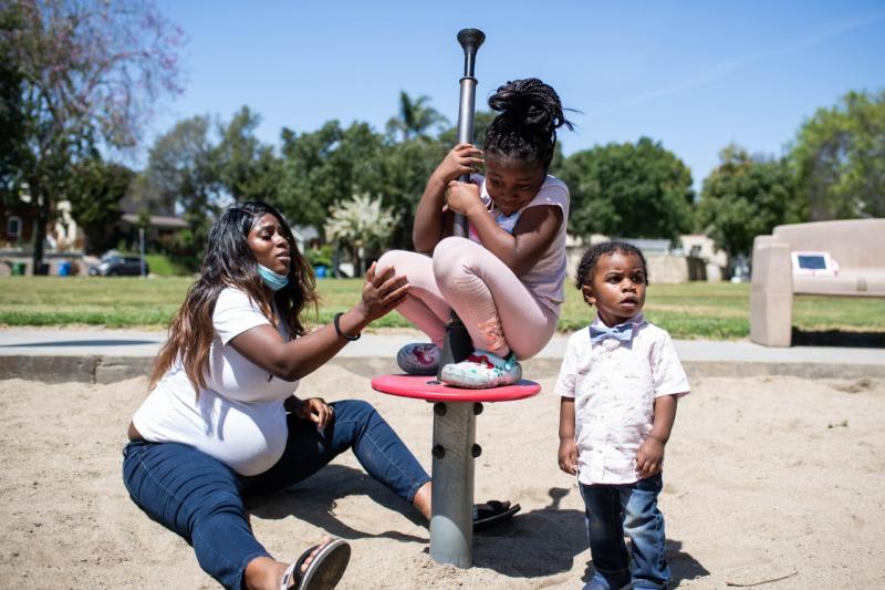 Pregnant with her third child Aysha-Samon Stokes, 26, plays with her children Nyla Richmond, 6, and Wyatt Richmond, 17 months, at a Culver City park close to her daughter’s school on Thursday, April 8, 2021. Looking for a better birthing experience Stokes found a midwife to deliver her baby. (Photo by Sarah Reingewirtz, Los Angeles Daily News/SCNG)