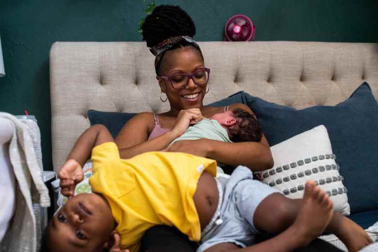 MyLin Stokes Kennedy rests at home on Thursday, September 16, 2021 with her son Lennox and Maddox, who her wife Lindsay delivered in their Fountain Valley home days ago. (Photo by Sarah Reingewirtz, Los Angeles Daily News/SCNG)