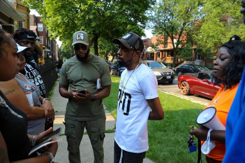 Chicago CRED street outreach workers canvas the Pullman and Roseland neighborhoods on a recent Saturday. Former U.S. Secretary of Education Arne Duncan launched the group after a historic spike in gun violence in 2016. Olivia Obineme for The Trace