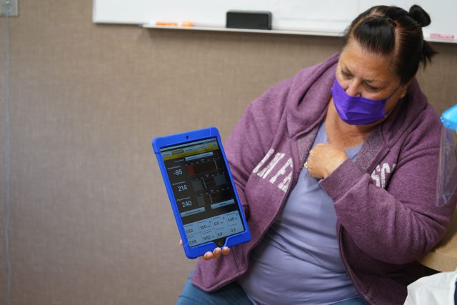 Kalani Pagan’s wife Kim Pagan monitors the dialysis machine wirelessly with a tablet. The data can be seen in real time by medical staff on Oahu. 