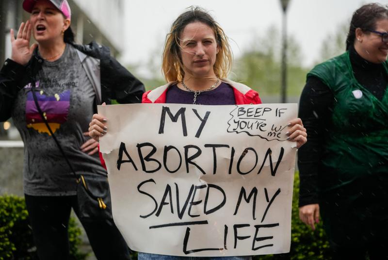 An abortion rights supporter protests in support of abortion rights near the Supreme Court of Ohio. The protest comes a day after a U.S. Supreme Court draft decision overturning Roe v. Wade was leaked. The 1973 landmark ruling protects a woman's right to choose to have an abortion. Joshua A. Bickel, Columbus Dispatch/USA TODAY Network
