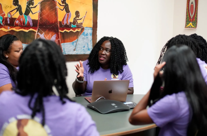 Ndidiamaka Amutah-Onukagha meets with a group in an office. Amutah-Onukagha is a maternal health care researcher at Tufts University in Boston, Mass. Originally from Trenton, NJ, the hospital where Amutah-Onukagha was born has since closed down. MARY SCHWALM, FOR USA TODAY
