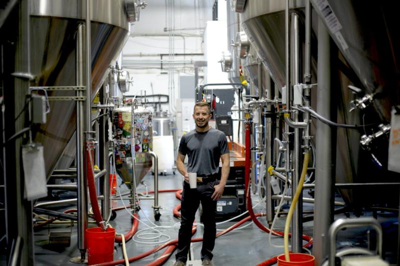 Jeff Erway stands in one section of his brewery in Albuquerque. La Cumbre Brewing is one of New Mexico’s largest craft beer companies. CREDIT: Marjorie Childress for New Mexico In Depth
