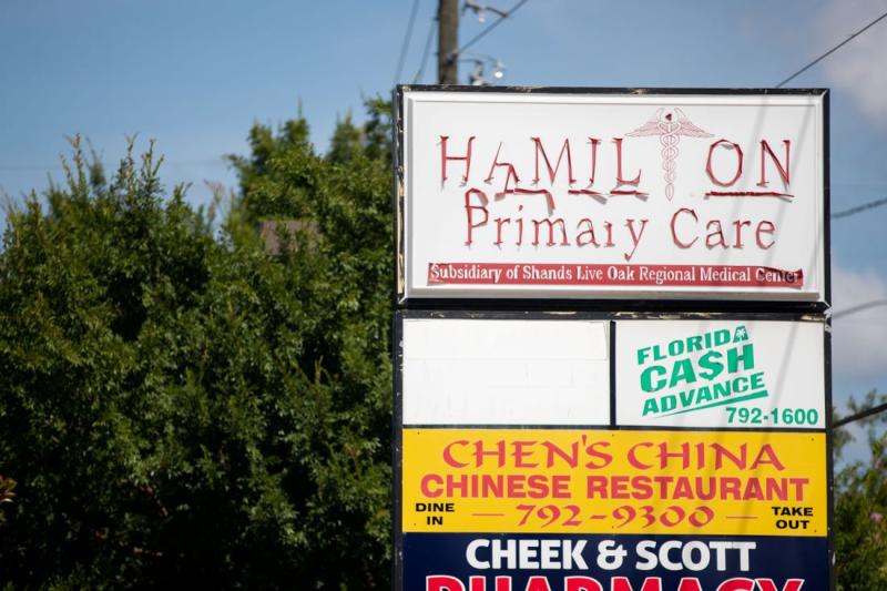 Lettering for a sign for Hamilton Primary Care peels from the surface. The medical practice has vanished from the shopping plaza. ALICIA DEVINE, USA TODAY NETWORK