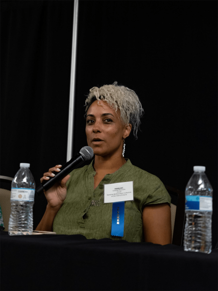 Chantel Runnels explains her role as a doula during a panel at the Inland Empire Perinatal Equity Provider and Community Summit at Cal Baptist University in Riverside, CA on September 16, 2022 (Aryana Noroozi for Black Voice News/CatchLight Local).