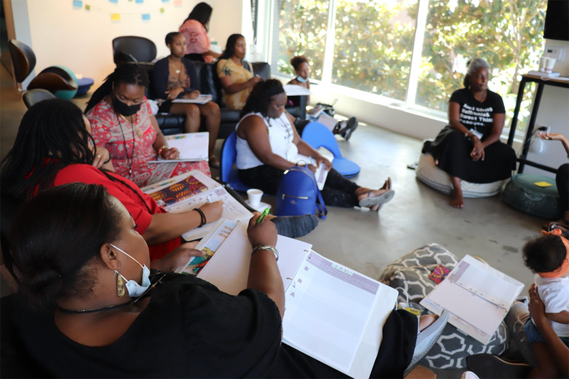 Attendees take notes as they participate in Black Community Doula Training hosted by Riverside Community Health Foundation (RCHF) as part of the Doula Access Program in July 2022. Eleven participants graduated from the training (Image courtesy of RCHF).