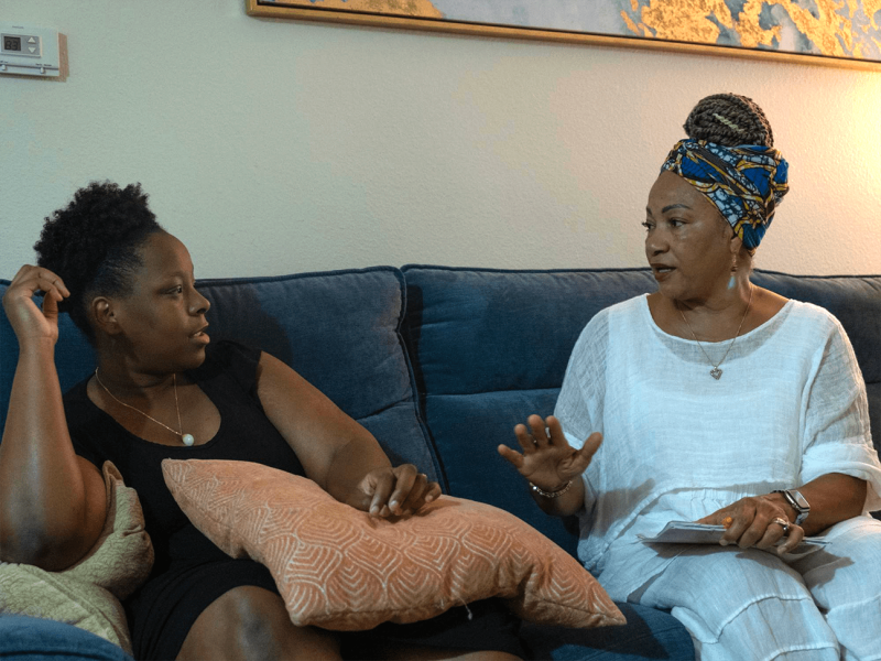 Karen Sykes and Nalah Morrow discuss Morrow’s most recent Ob/Gyn visit and how she feels about her provider during a home visit in Chino, CA on June 26, 2022 (Aryana Noroozi for Black Voice News/CatchLight Local).