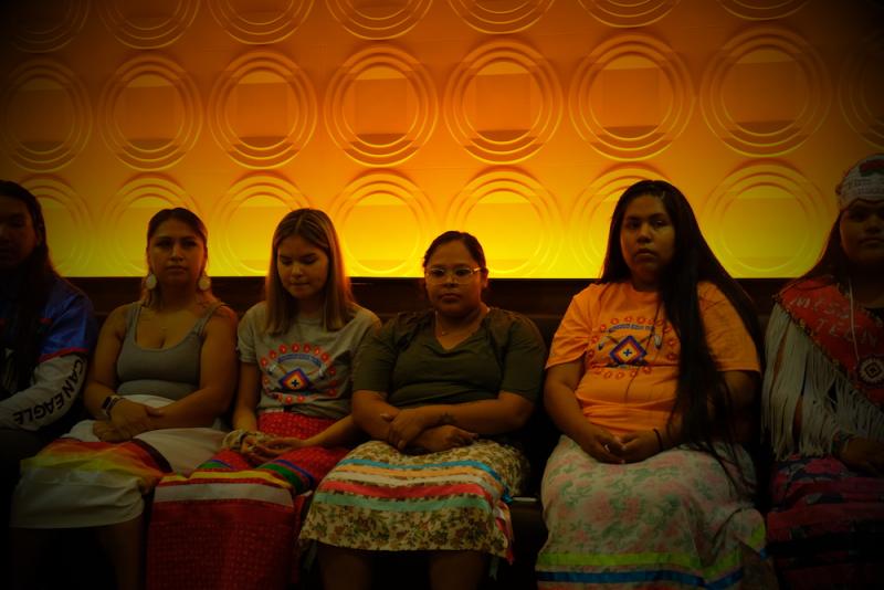 PICTURED: Janis (orange shirt, second from right) in 2021 at the Carlisle disinterment ceremony in Carlisle, Pennsylvania with members of the Rosebud Sicangu Youth Council. “Healing for me is uncovering trauma, whether you experience it or your parents or your grandparents experienced it,” Rachel Janis said at the time. “When I was younger, I didn’t understand what I was going through. When we first came to Carlisle, although I never experienced boarding schools, I think that was another stem of where that might have come from." (Photo: Jenna Kunze)