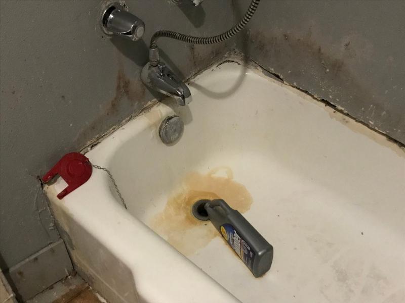 Dedric Harris said a clogged tub forced him and his wife to use a moldy walk-in shower in the master bedroom. TALIS SHELBOURNE / MILWAUKEE JOURNAL SENTINEL