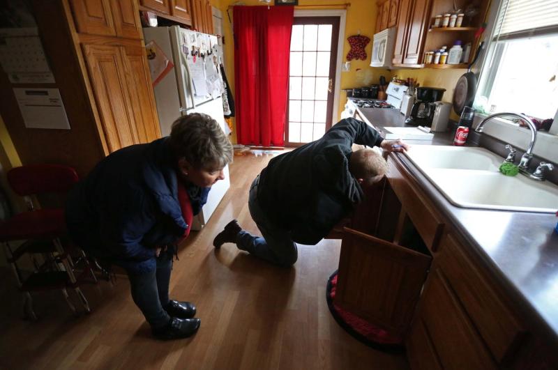 Carolyn Schaefer, a registered nurse and healthy homes specialist, and Mike Miller, a city of Des Moines code enforcement officer inspect a home for environmental causes of asthma March 1, 2016, in Des Moines. In 2016, Des Moines, Iowa, launched a program to find and fix household problems that contribute to childhood asthma. It was supported by Polk County and the city’s three main hospital companies, Mercy, UnityPoint and Broadlawns. KELSEY KREMER / REGISTER