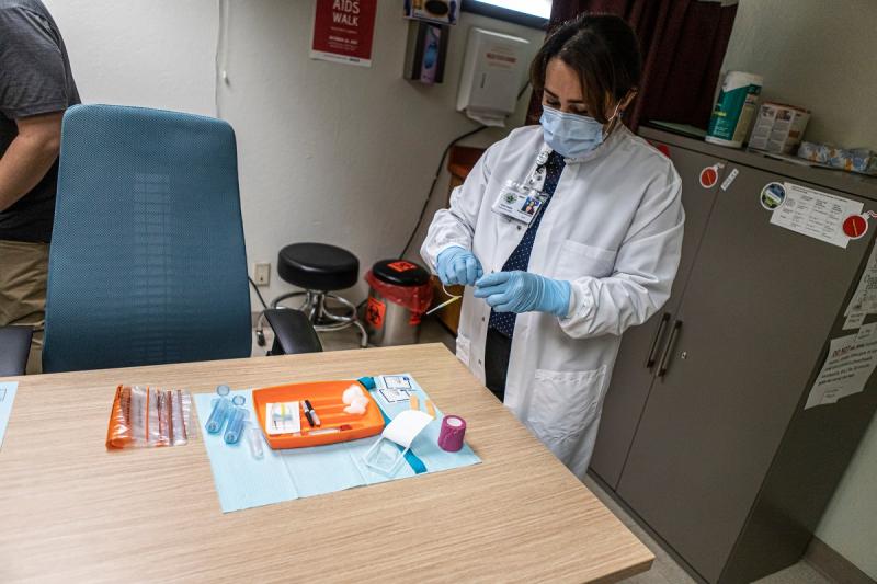 Nurse prepares blood draw at the Fresno County Department of Public Health on June 9, 2022. Photo by Larry Valenzuela, CalMatters/CatchLight Local