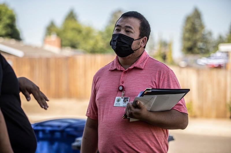 STD Investigator Hou Vang speaks with a pregnant patient to inform them of their diagnosis and provide information on July 14, 2022. Photos by Larry Valenzuela, CalMatters/CatchLight Local