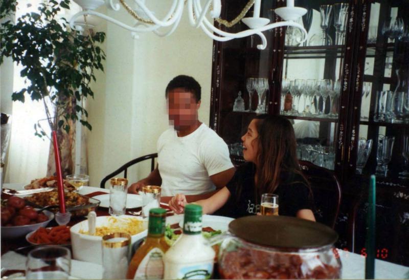 inewsource investigative reporter Jennifer Bowman, right, as a child sits next to her stepbrother for dinner at their family’s Chula Vista home in this undated photo. inewsource obscured his face to avoid identifying him. (Courtesy of Harvey McDonald)