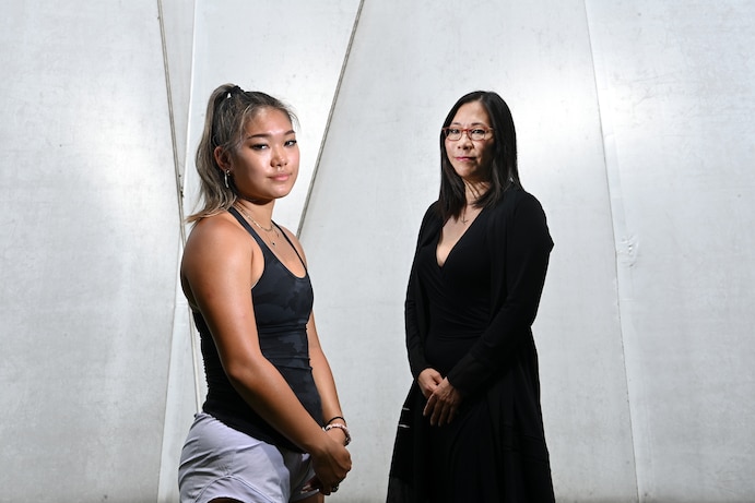 Reina Chiang and her mother, Kana Enomoto, pose for a portrait. Chiang has started a nonprofit to help others struggling with mental health issues. (Matt McClain/The Washington Post)