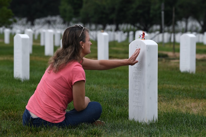 Cheryl Chafos visits Zach's grave at Arlington National Cemetery in June. (Matt McClain/The Washington Post)