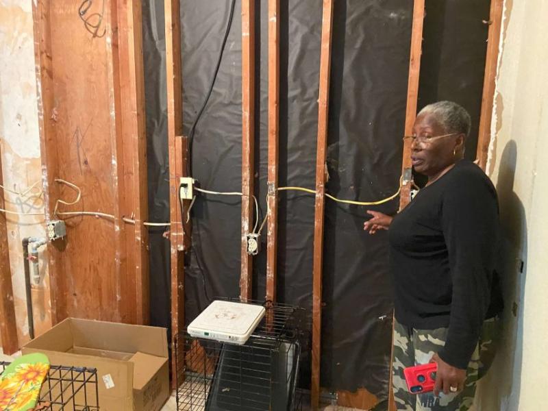 Margie Miller shows off her kitchen following the July 5 accident. Despite a notice of violation, management has not repaired it. Photo taken by Annika Hom in Oct. 6, 2021.