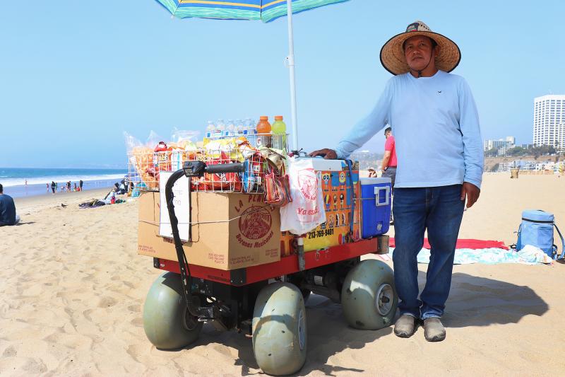 Delfino Caranza sells ice cream, chips and beverages from a makeshift beach cart in Santa Monica.