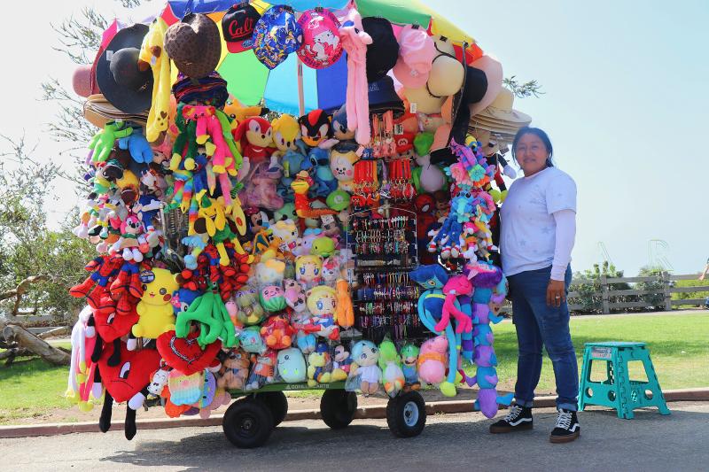 Dulce Sanchez sells peluches, stuffed animals, at Palisades Park in Santa Monica