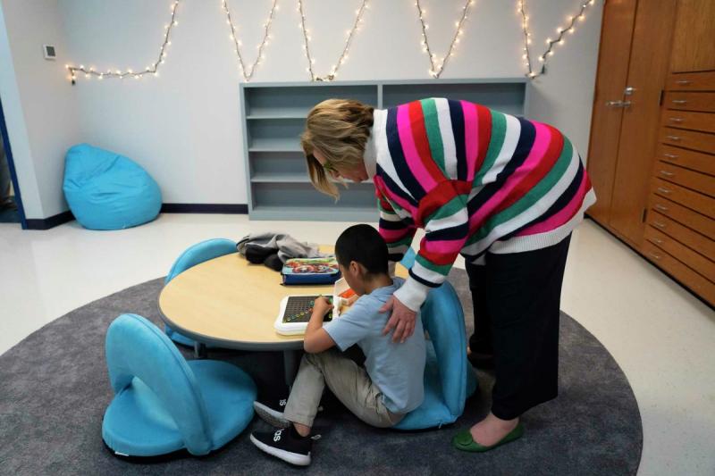 Sally Herrell, principal of Clear Creek Intermediate School in Sanger, visits with a student using a light bright in the chill zone classroom in March. The room was put in last year with the help of grant money to give students a place to unwind and relax so that they have better classroom outcomes.  Mark Mulligan, Houston Chronicle / Staff photographer
