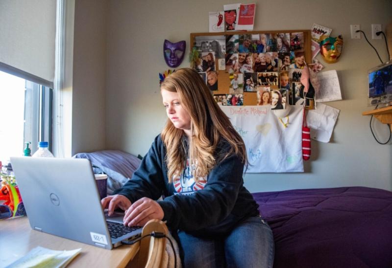 Nikole Powell checks her email on March 16 in her room at Southern Maine Women’s Reentry Center in Windham. Residents in the program are allowed email and limited internet access for education. Powell also has permission to work on legislative work. Andree Kehn/Sun Journal