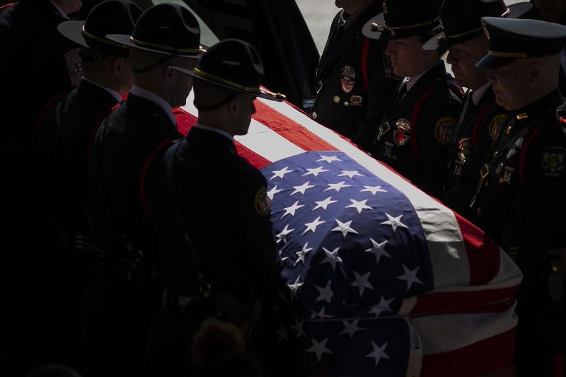 Springdale Police Department officers lift the casket of fellow officer Kaia Grant from the hearse for her funeral service at Vineyard Church in Springdale, March 29, 2020. Grant was killed in the line of duty March 21, 2020. AMANDA ROSSMANN/THE ENQUIRER
