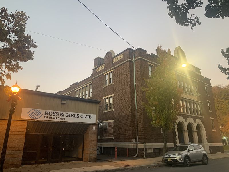 A developer wants to demolish the former Boys & Girls Club of Bethlehem, 117 E. Fourth St., to build a mixed-use development. The building is sandwiched between Holy Infancy School and the Brinker Lofts.Sara K. Satullo | For lehighvalleylive.com