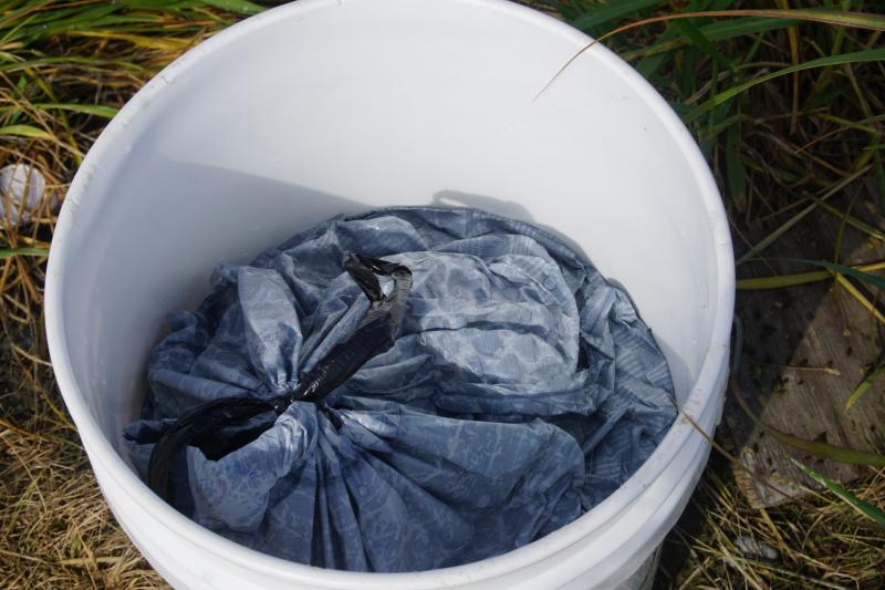 Human waste is collected in plastic bags in honey buckets, before being hauled to a sewage lagoon. (Yereth Rosen)