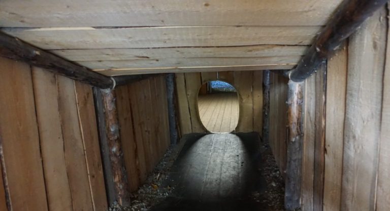An exhibit at the Alaska Native Heritage Center in Anchorage shows a version of a traditional Inupiat/Siberian Yu’pik tunnel entryway (modified for visitors to walk through), a design that allowed for ventilation while conserving heat. (Yereth Rosen)