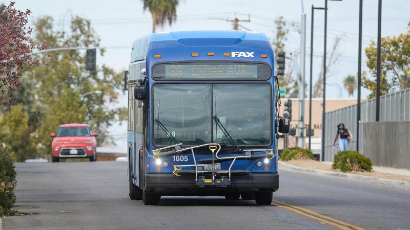 A FAX bus drives down South Walnut Avenue between the West Fresno Branch Library and Edison High School on Wednesday, Oct. 20, 2021. CRAIG KOHLRUSS CKOHLRUSS@FRESNOBEE.COM