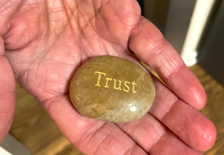 In her purse, Lisa Rowe keeps a stone with the word "Trust"” A hospital chaplain gave it to her while her son was in the ICU. She often runs her fingers across the engraved word as a reminder to trust that she and her son will somehow make it through their difficulties. (William Wan/The Washington Post)