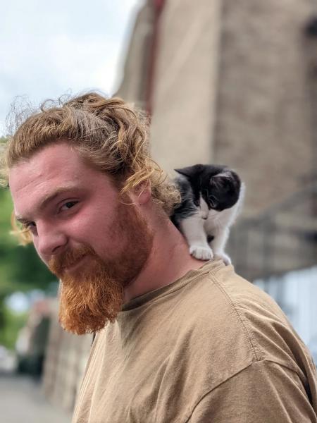 Jerry Adams, who this summer was living in a tent in downtown Portland, poses with his cat. Casey Toner / BGA