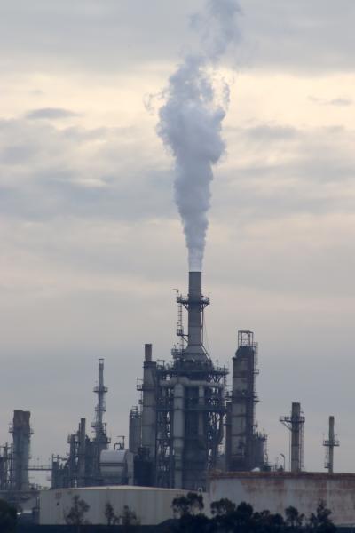 Plumes of smoke emerge from a refinery in Wilmington, California. Grace Mahoney