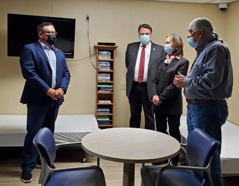 Santa Barbara County’s sobering center includes a four-bed room for women with a television and a small table. Congressman Salud Carbajal, left, requested a tour of the facility.  Giana Magnoli / Noozhawk photo