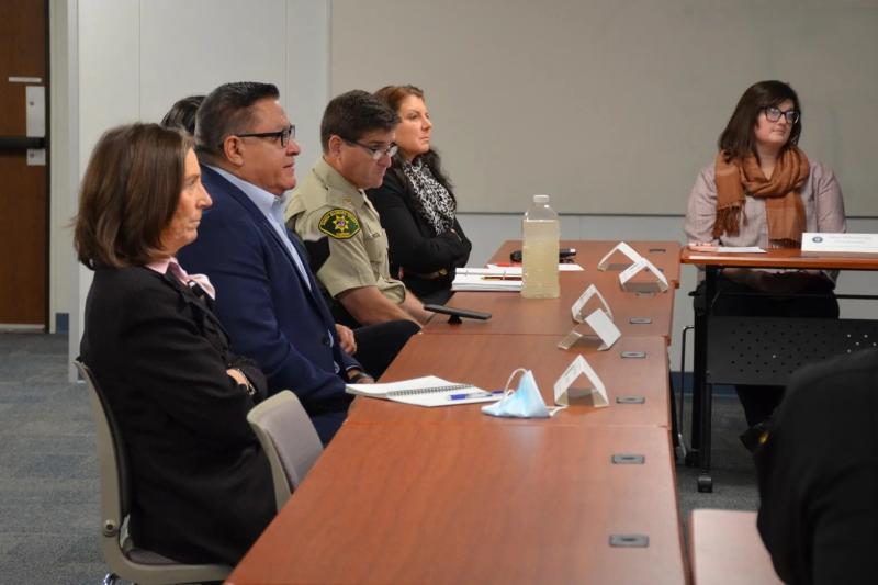Santa Barbara County Third District Supervisor Joan Hartmann, left, and Congressman Salud Carbajal, second from left, listen to an update on behavioral health and criminal justice department collaborative programs during a Dec. 19 event.  Giana Magnoli / Noozhawk photo