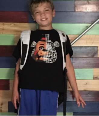 Bennett Solomond poses for a photo on the first day of fourth grade in 2016.