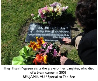Thuy Thanh Nguyen visits the grave of her daughter, who died of a brain tumor in 2001. BENJAMIN VU / Special to The Bee